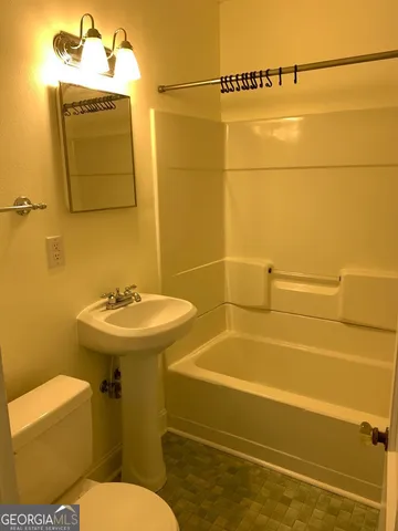 a bathroom with a sink and a toilet