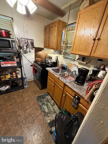 a kitchen with a stove and a refrigerator