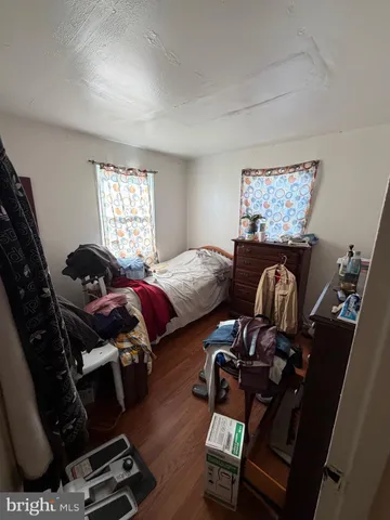 a bedroom with bed and window