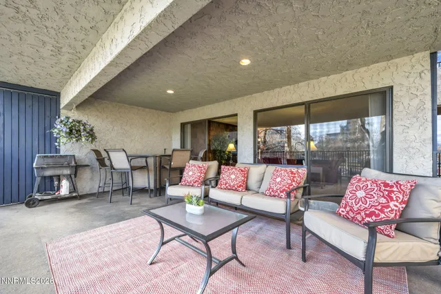 a dining room with furniture and window