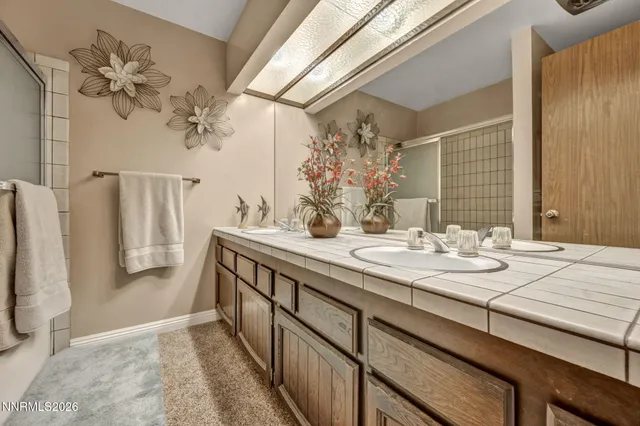 a bedroom with a bed and a lamp