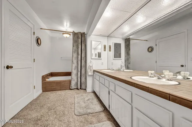a view of pool table and chairs