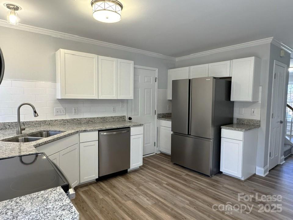 15210 Tracy Beth Road Huntersville, NC 28078 - Photo 3 of 13 a kitchen with a refrigerator sink and cabinets