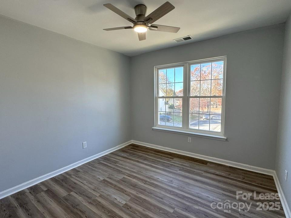 15210 Tracy Beth Road Huntersville, NC 28078 - Photo 10 of 13 a view of a room with wooden floor and windows