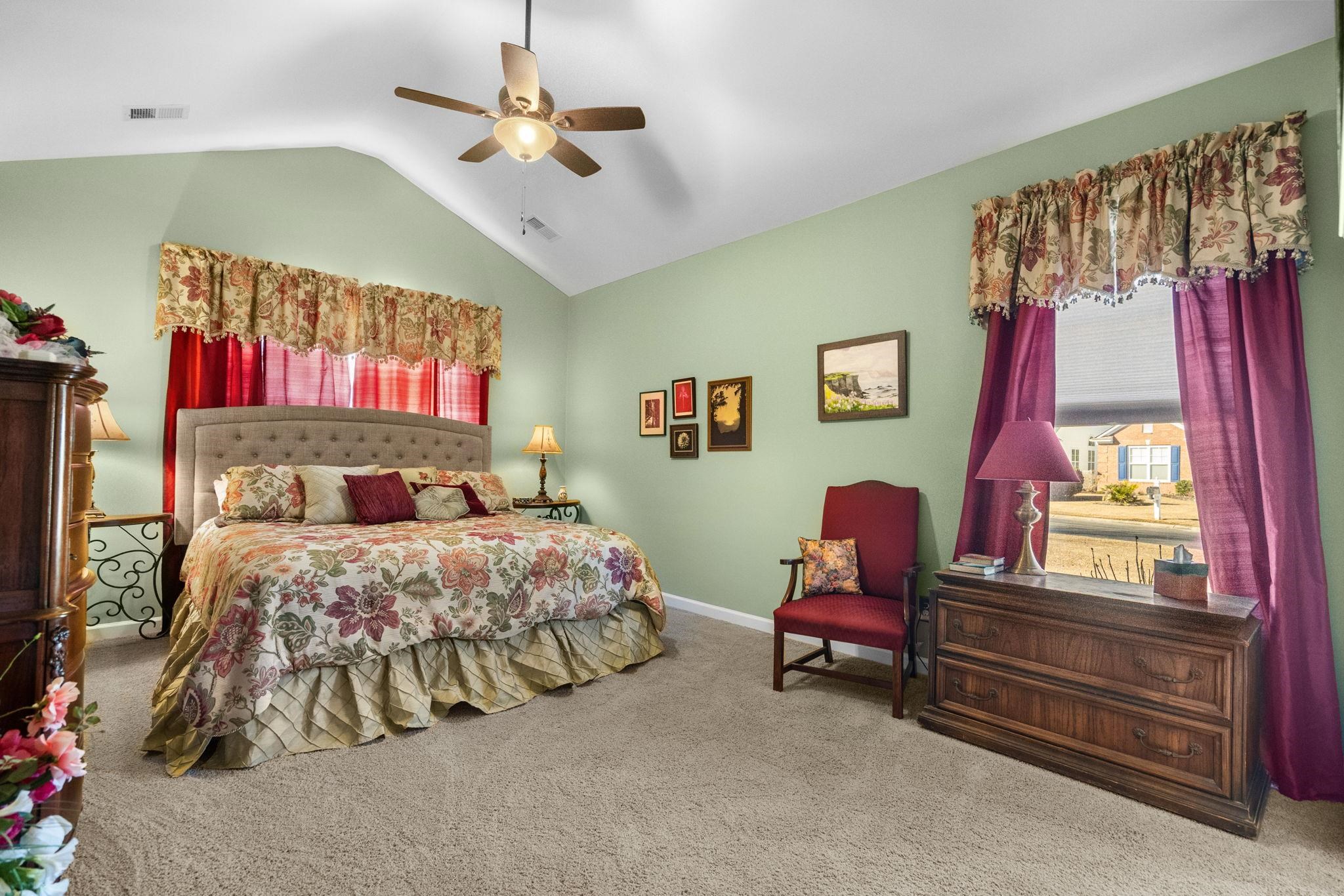 699 Bullrush Court Calabash, NC 28467 - Photo 20 of 40 Carpeted bedroom featuring lofted ceiling and ceiling fan