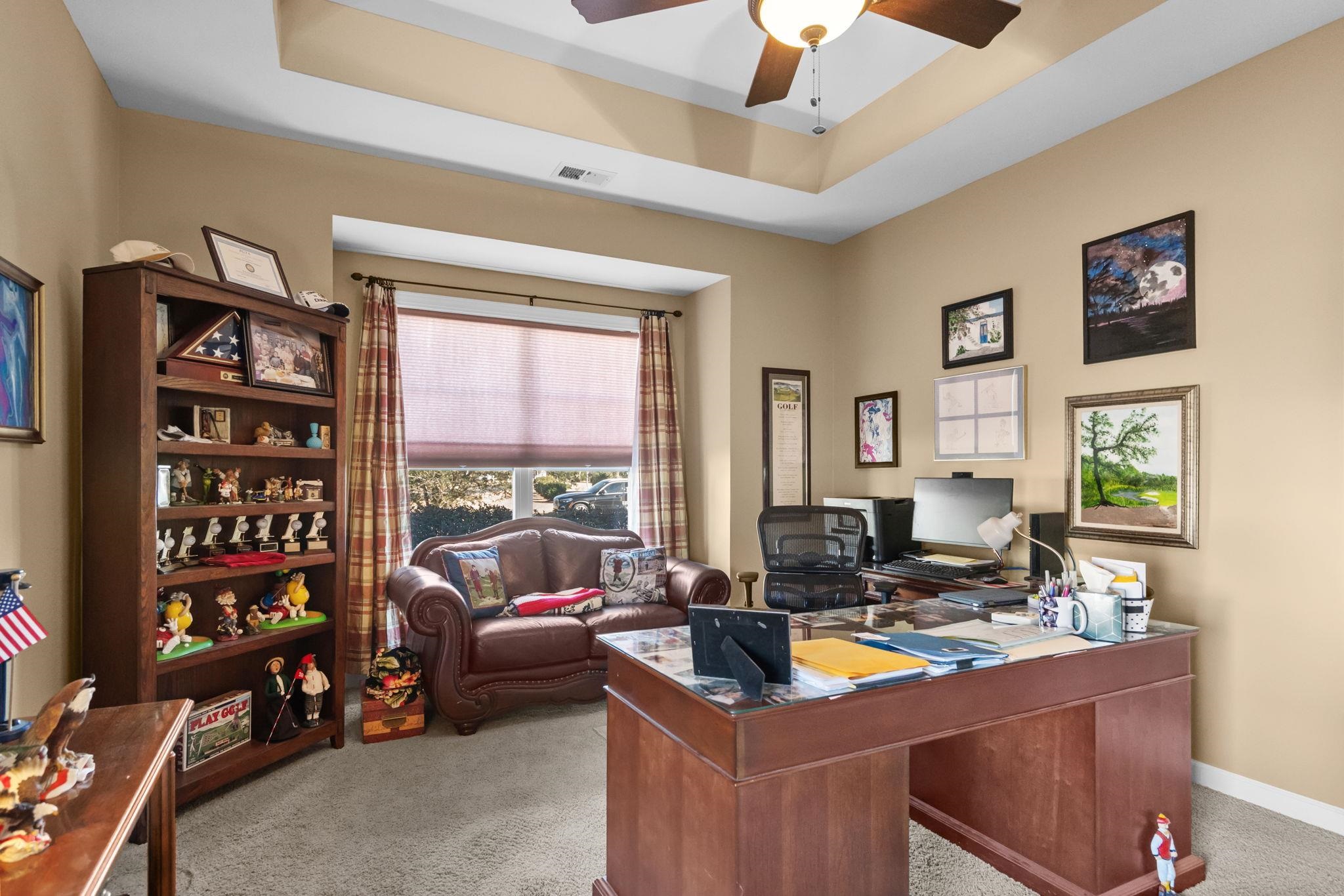 699 Bullrush Court Calabash, NC 28467 - Photo 25 of 40 Office area featuring a raised ceiling, light colored carpet, and ceiling fan
