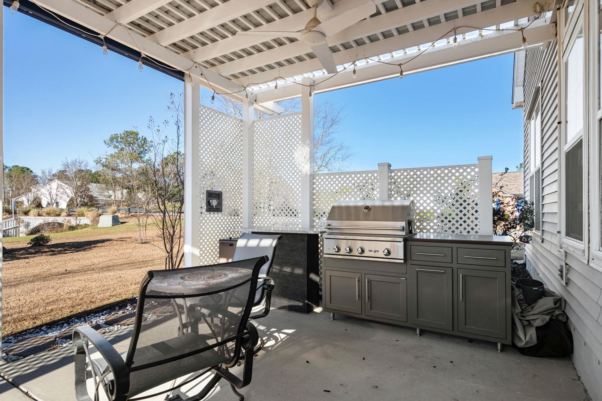 699 Bullrush Court Calabash, NC 28467 - Photo 31 of 40 View of patio featuring area for grilling and a ceiling fan