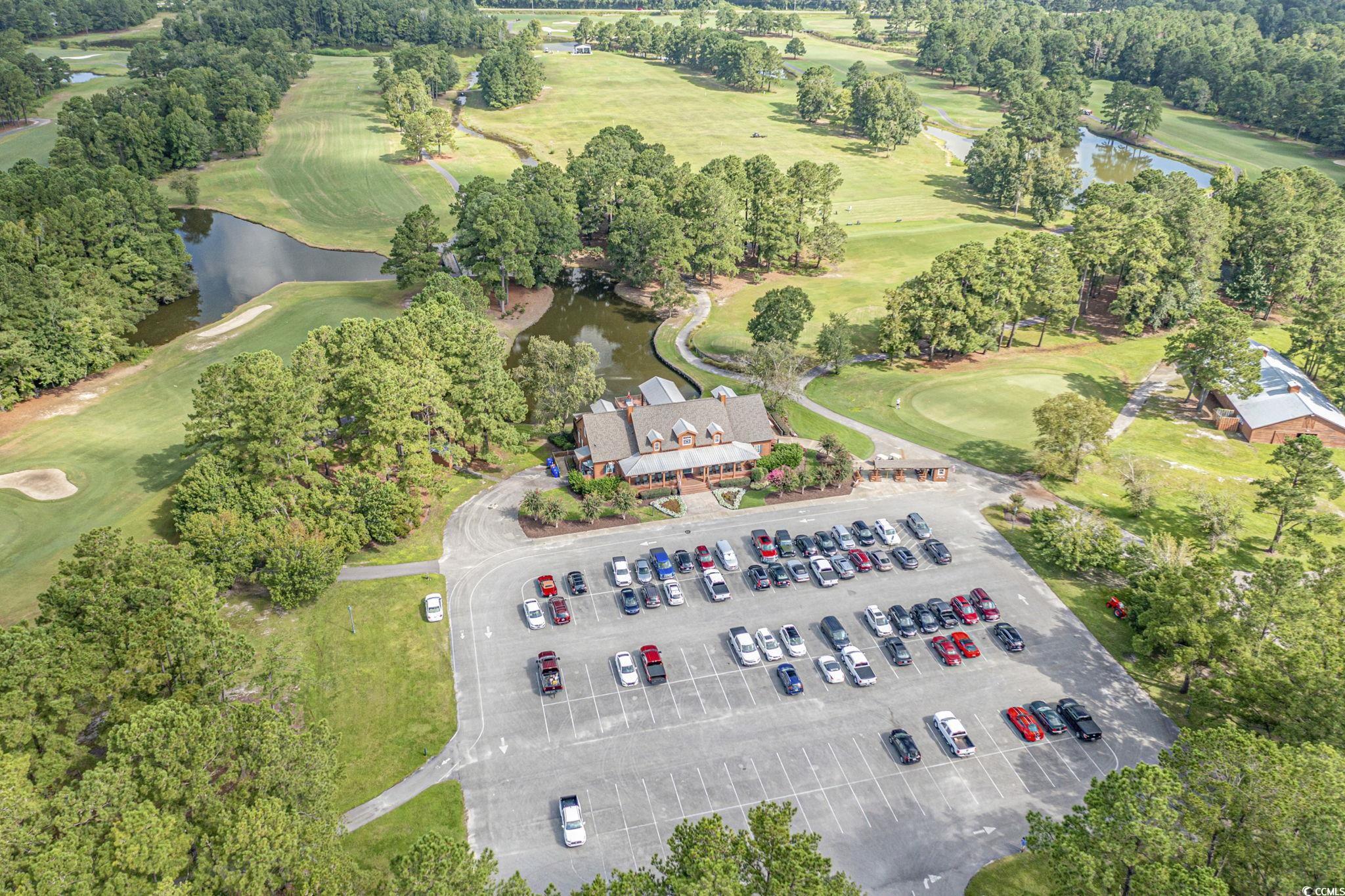 699 Bullrush Court Calabash, NC 28467 - Photo 37 of 40 Bird's eye view of a golf course and a nearby body of water