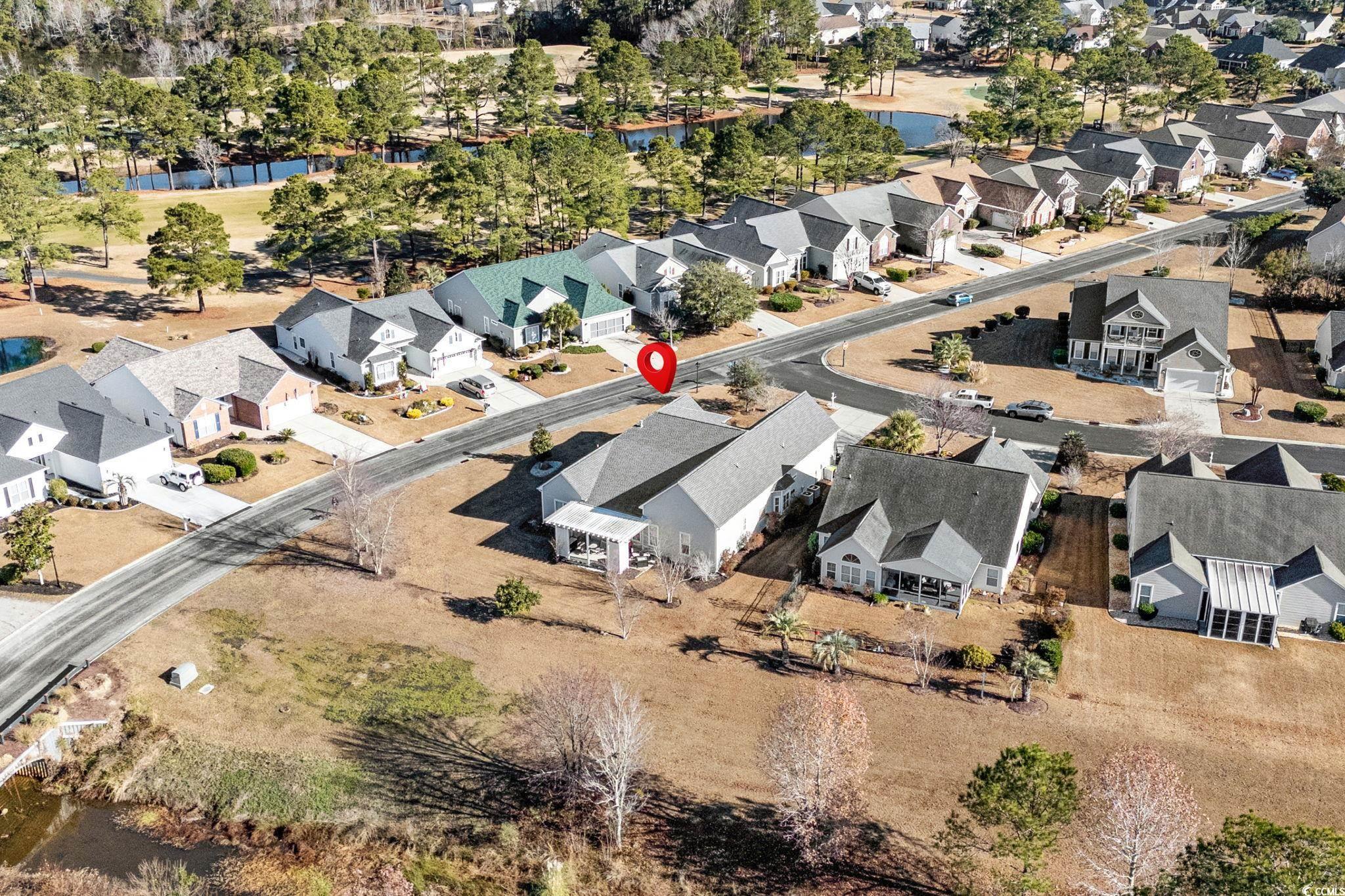 699 Bullrush Court Calabash, NC 28467 - Photo 38 of 40 Aerial perspective of suburban area featuring a large body of water