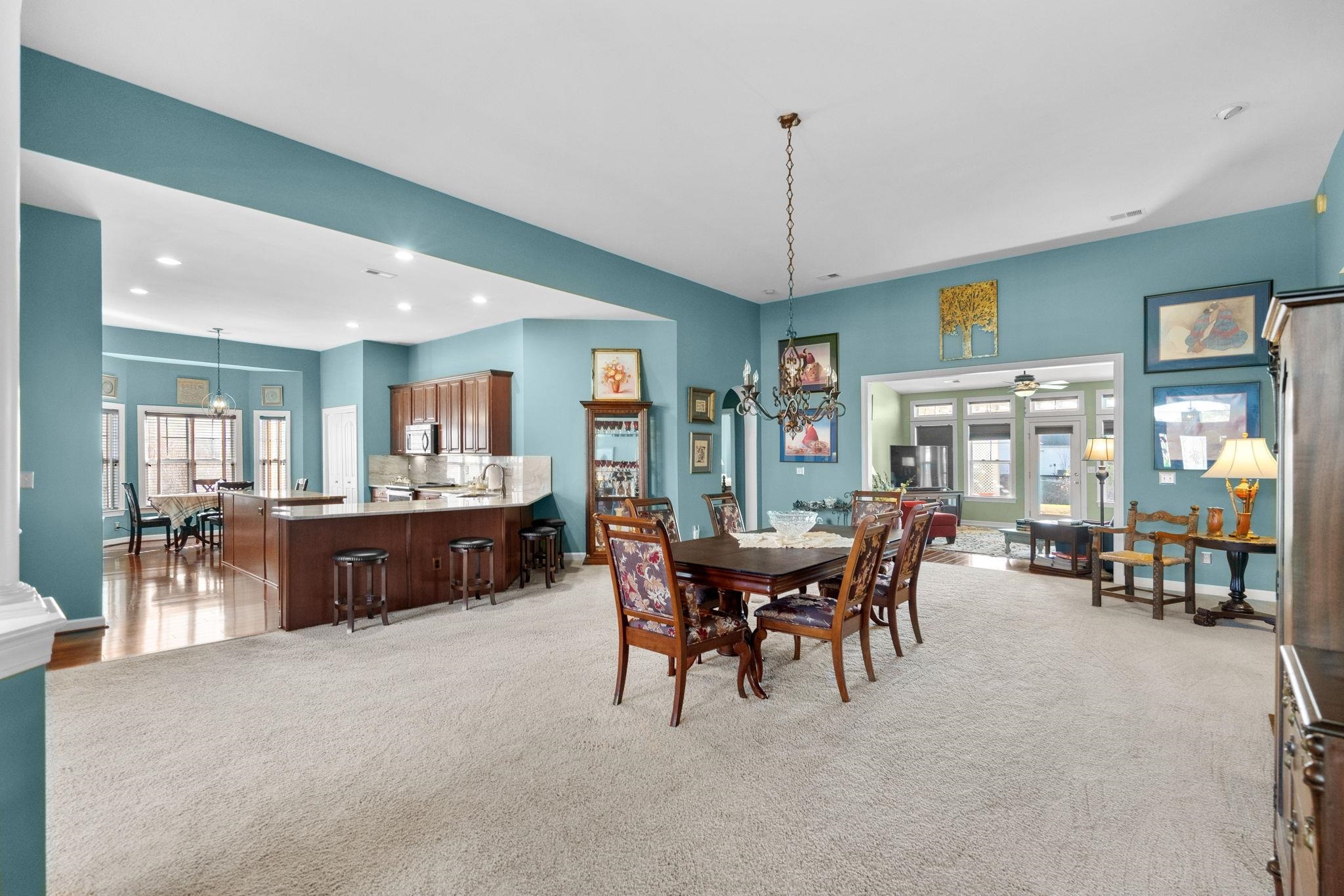 699 Bullrush Court Calabash, NC 28467 - Photo 5 of 40 Dining area with a chandelier, plenty of natural light, light carpet, and recessed lighting