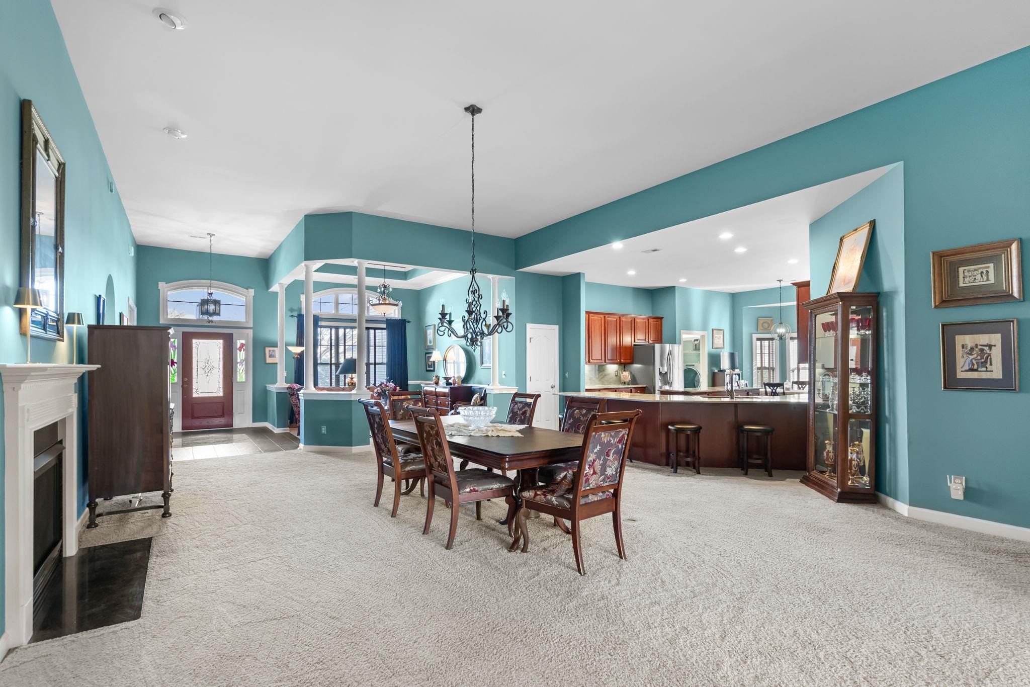 699 Bullrush Court Calabash, NC 28467 - Photo 6 of 40 Dining space featuring light carpet, a chandelier, and recessed lighting