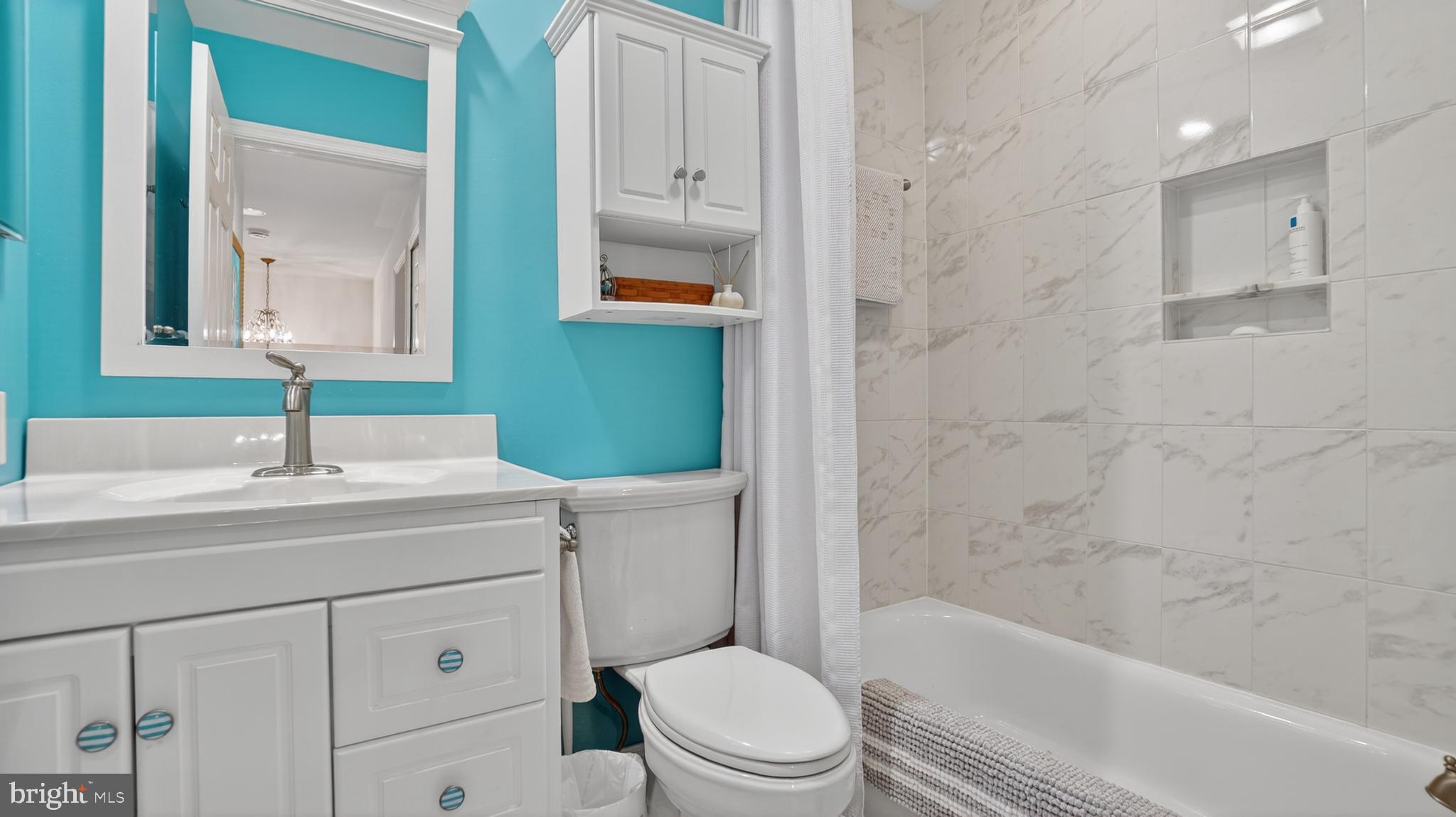 317 Canterfield Road Annapolis, MD 21403 - Photo 38 of 66 a bathroom with a sink toilet vanity and shower