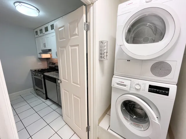 a bathroom with a sink vanity mirror and toilet