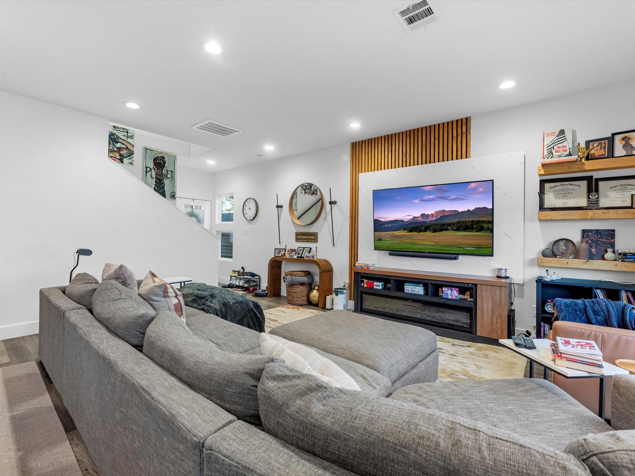 2222 Wavell Street Houston, TX 77088 - Photo 6 of 24 a living room with furniture and a flat screen tv
