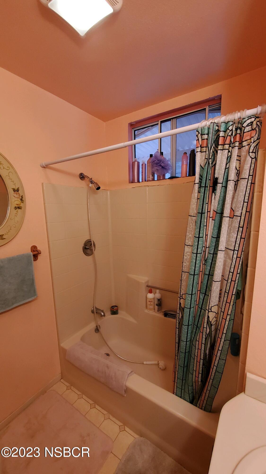 233 South E Street Lompoc, CA 93436 - Photo 11 of 17 a bathroom with a shower