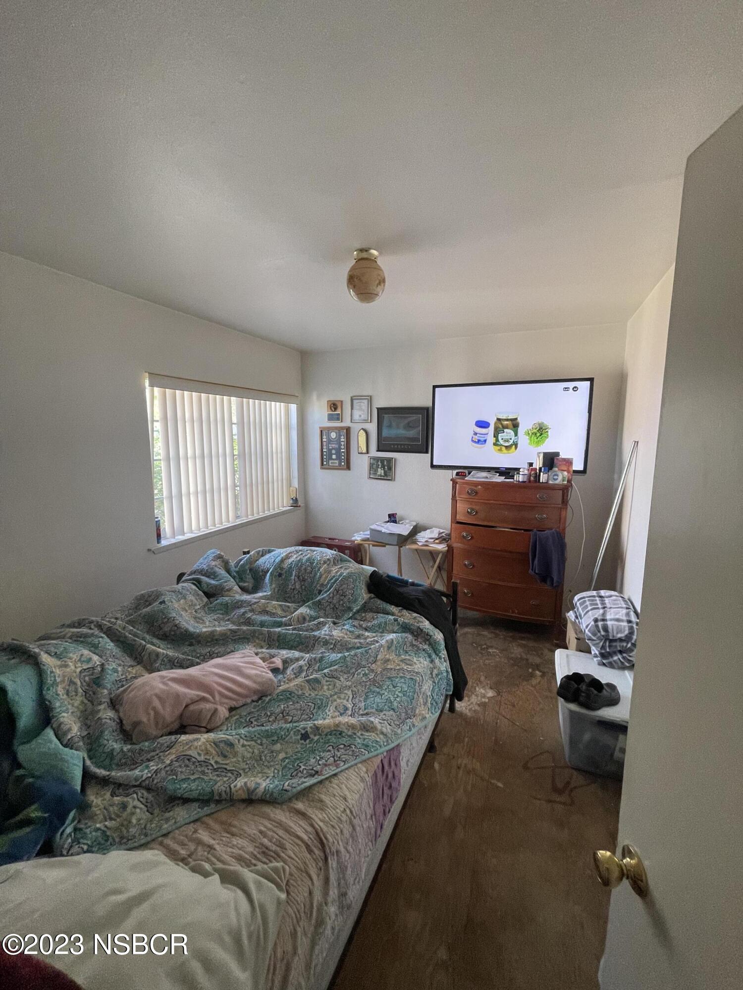 233 South E Street Lompoc, CA 93436 - Photo 5 of 17 a bed room with furniture and a window