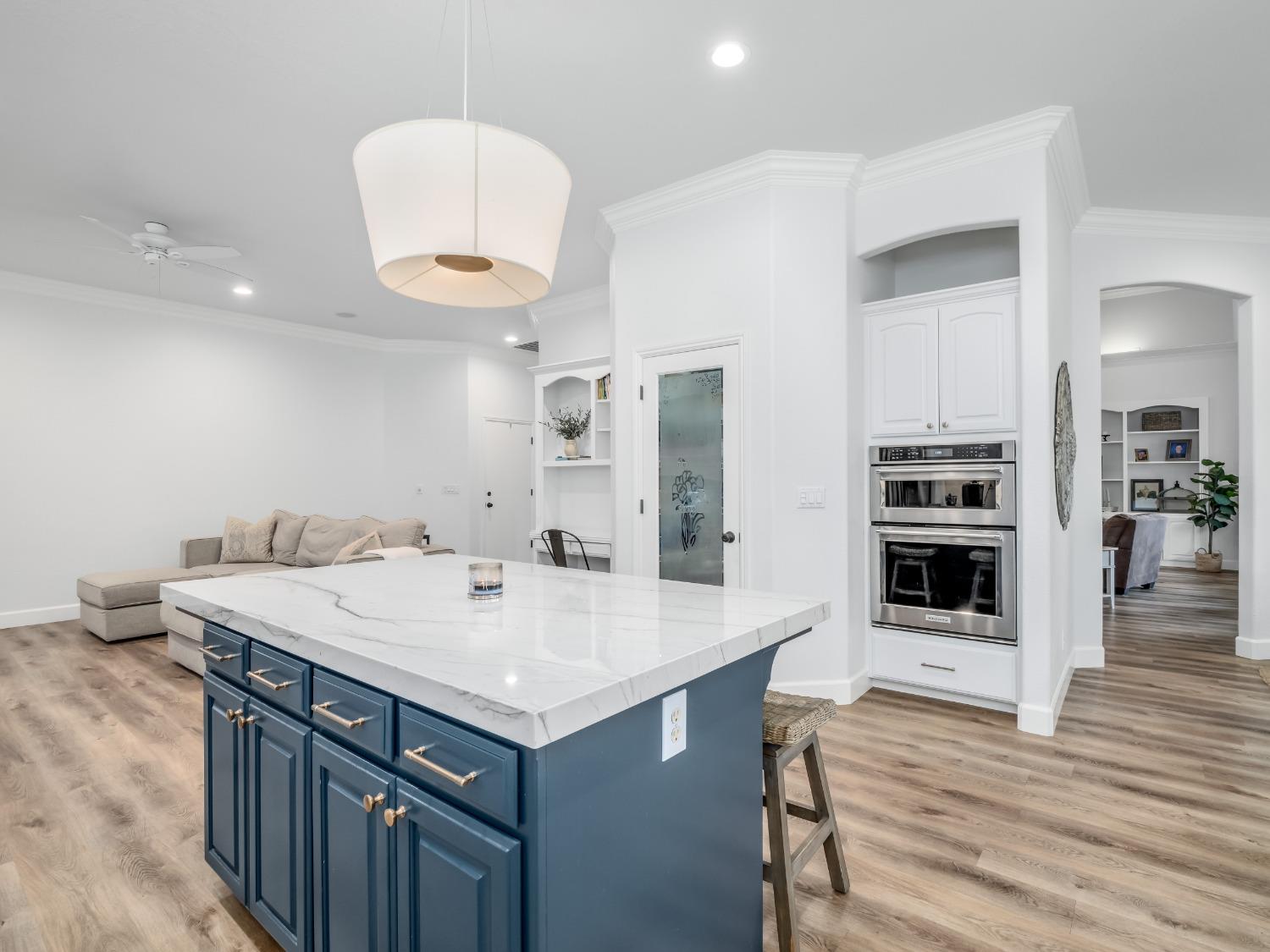 371 West Warwick Avenue Clovis, CA 93619 - Photo 16 of 42 a kitchen with a sink cabinets and wooden floor