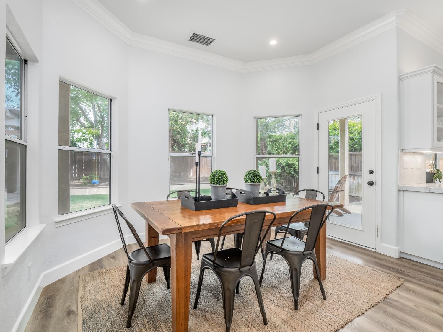 371 West Warwick Avenue Clovis, CA 93619 - Photo 17 of 42 a view of a dining room with furniture and window