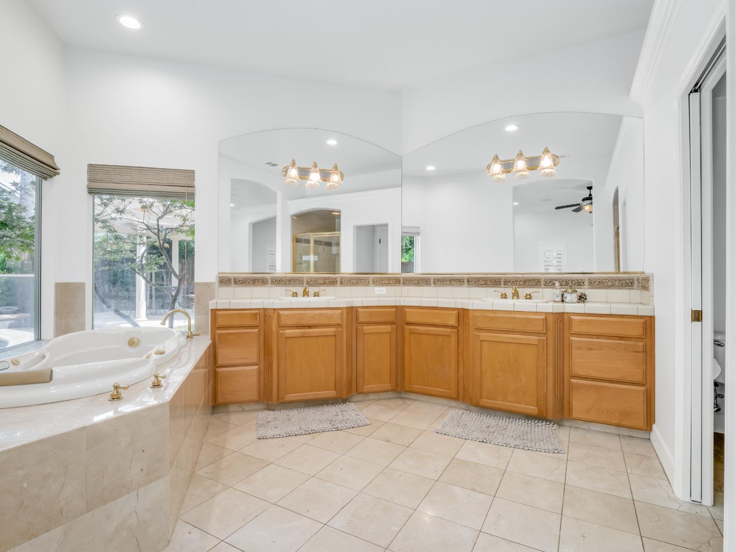 371 West Warwick Avenue Clovis, CA 93619 - Photo 22 of 42 a large kitchen with a sink and cabinets