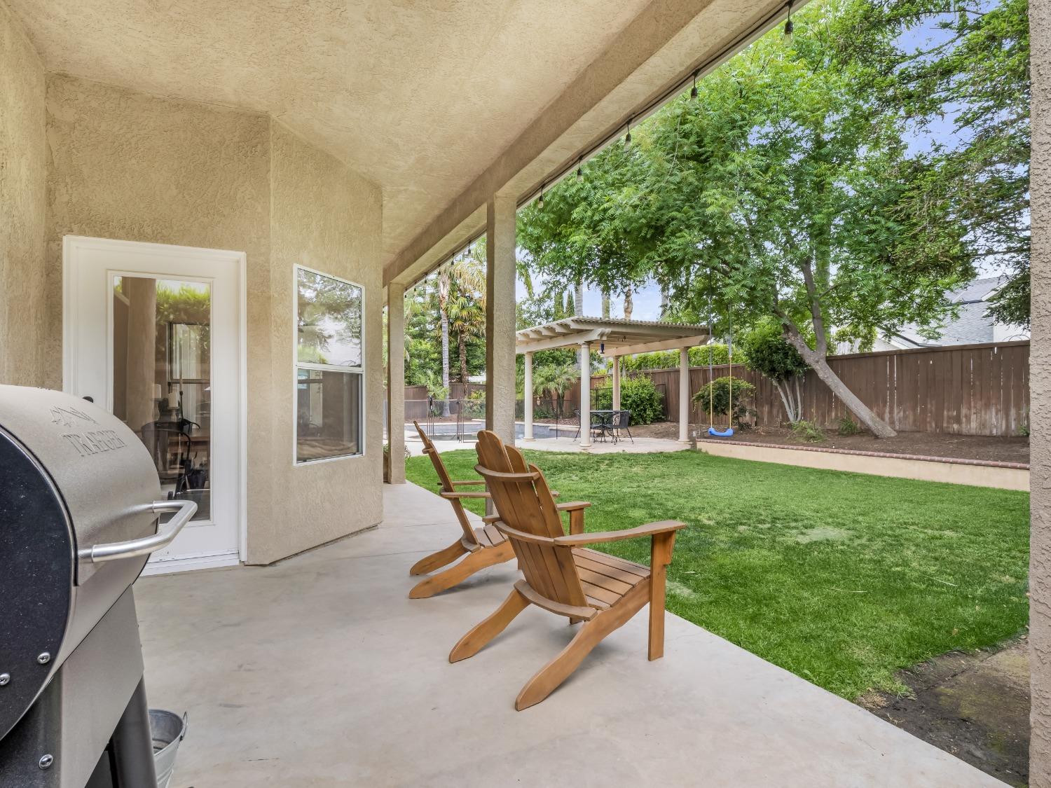 371 West Warwick Avenue Clovis, CA 93619 - Photo 35 of 42 a view of a house with backyard porch and sitting area