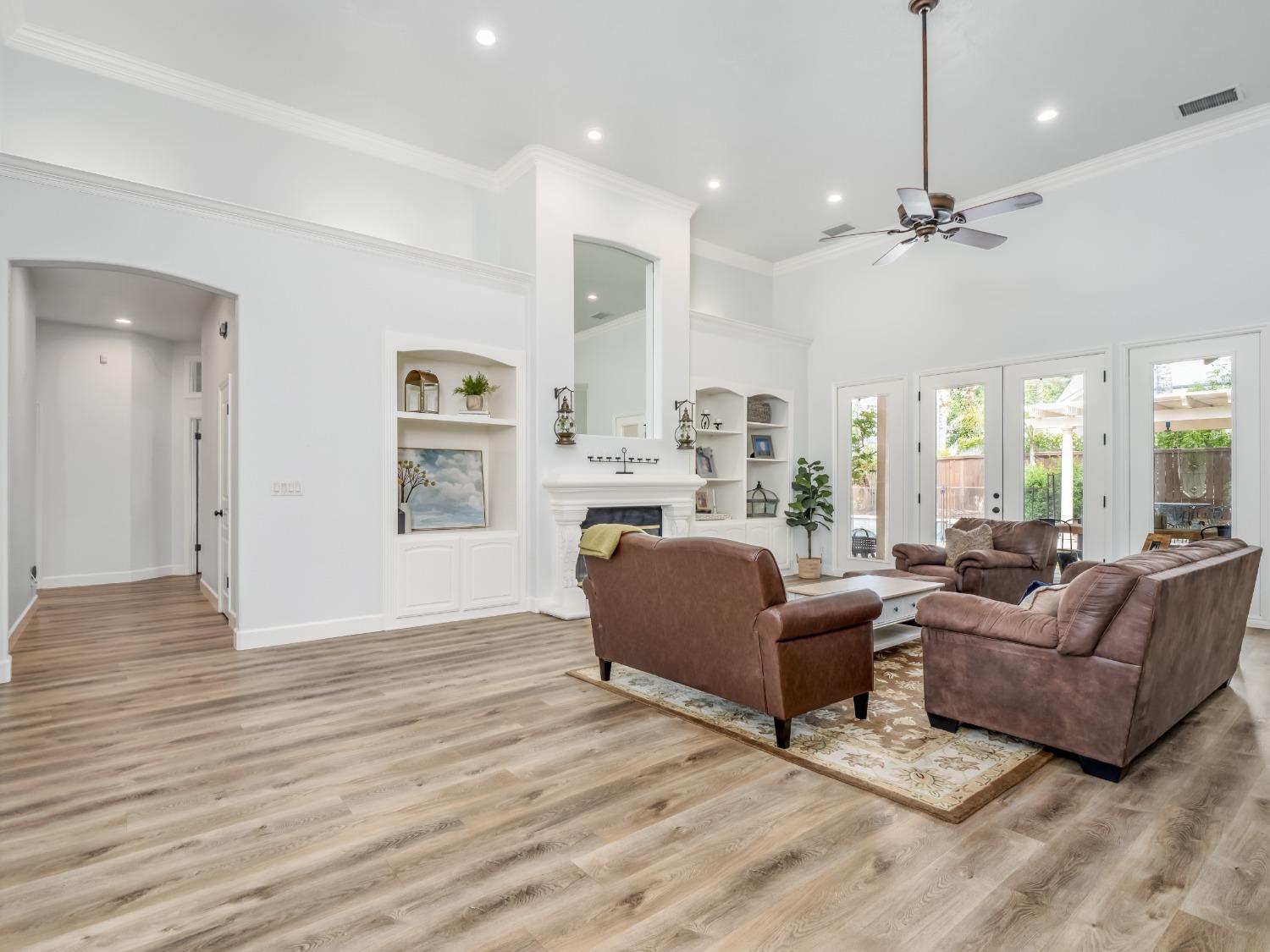371 West Warwick Avenue Clovis, CA 93619 - Photo 5 of 42 a living room with furniture or window and a wooden floor