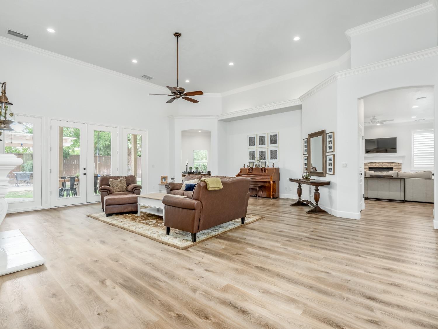 371 West Warwick Avenue Clovis, CA 93619 - Photo 6 of 42 a living room with furniture and a wooden floor