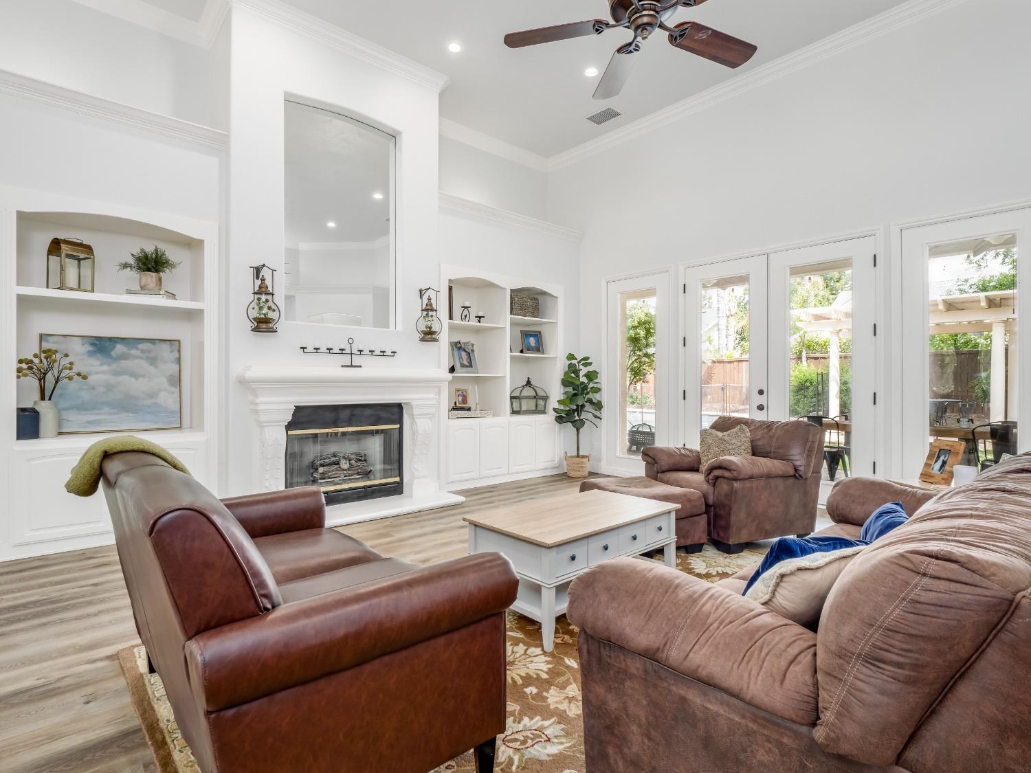 371 West Warwick Avenue Clovis, CA 93619 - Photo 8 of 42 a living room with furniture and a fireplace