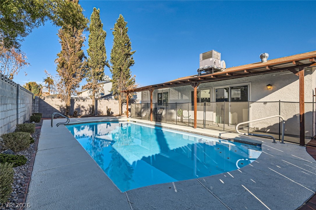 3665 Bronco Road Las Vegas, NV 89103 - Photo 28 of 28 An inviting backyard oasis offers a sparkling in-ground pool and shaded patio space.