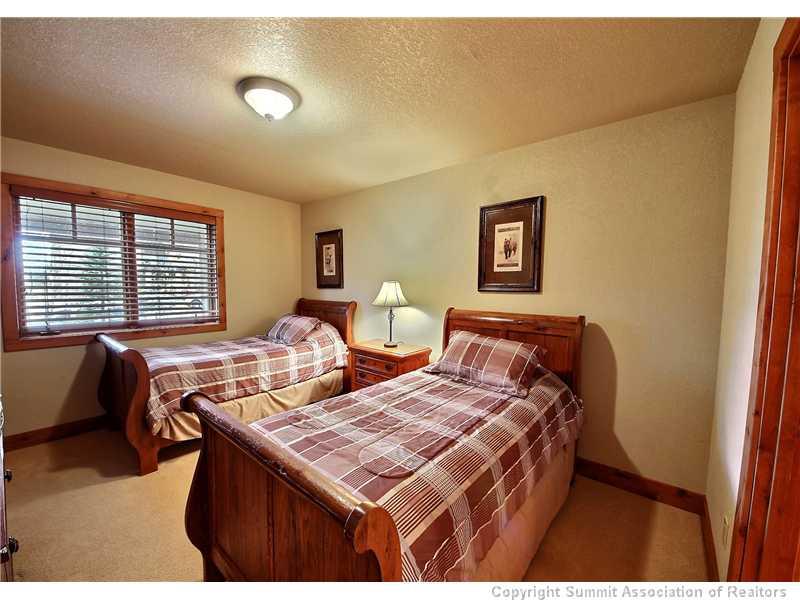 18 Rasor Drive, Unit 18 Keystone, CO 80435 - Photo 12 of 18 a bedroom with two beds and a couch