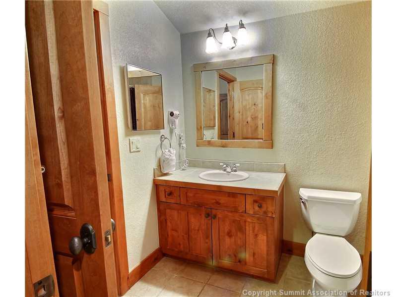 18 Rasor Drive, Unit 18 Keystone, CO 80435 - Photo 13 of 18 a bathroom with a toilet a sink and mirror