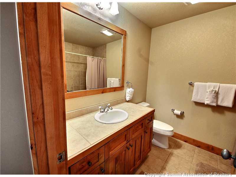 18 Rasor Drive, Unit 18 Keystone, CO 80435 - Photo 14 of 18 a bathroom with a sink and a mirror