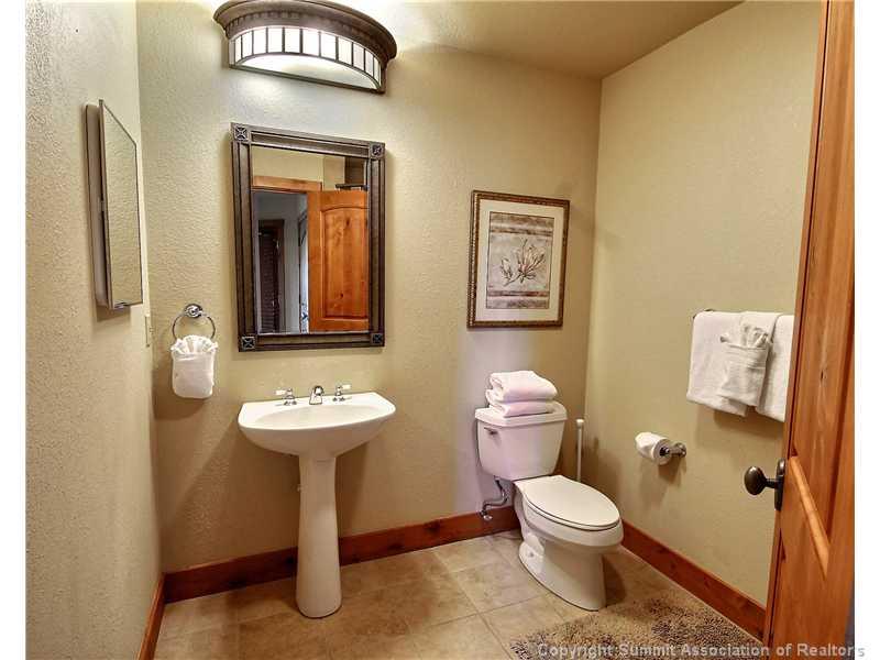 18 Rasor Drive, Unit 18 Keystone, CO 80435 - Photo 17 of 18 a bathroom with a toilet sink and mirror