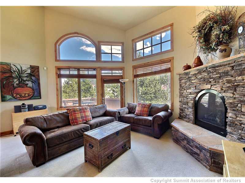 18 Rasor Drive, Unit 18 Keystone, CO 80435 - Photo 3 of 18 a living room with furniture a large window and a fireplace