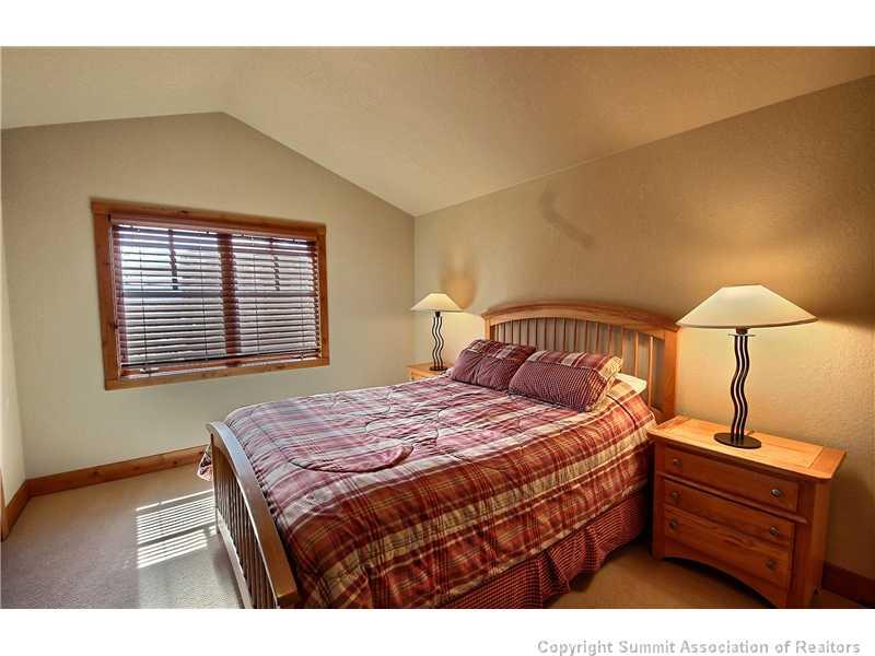 18 Rasor Drive, Unit 18 Keystone, CO 80435 - Photo 10 of 18 a bedroom with a bed and a window