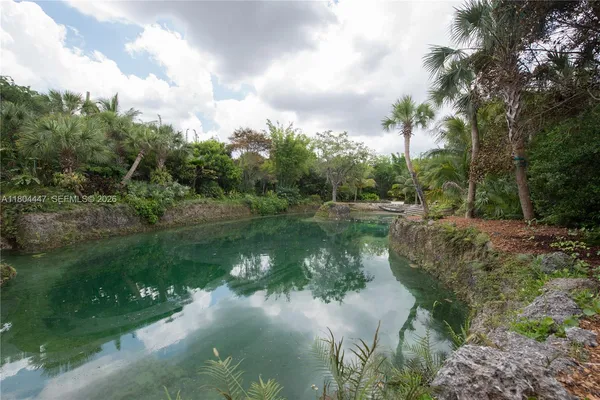 a view of house with outdoor space and car parked