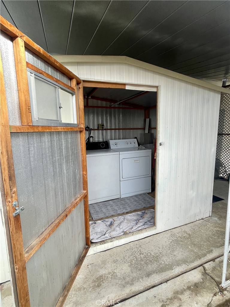 12995 6th Street Yucaipa, CA 92399 - Photo 11 of 13 a kitchen with a refrigerator and a stove