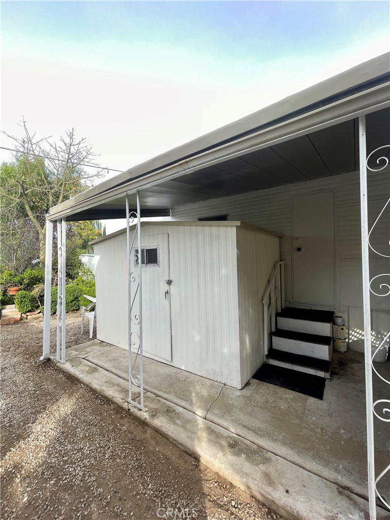 12995 6th Street Yucaipa, CA 92399 - Photo 12 of 13 a view of backyard with deck and wooden floor