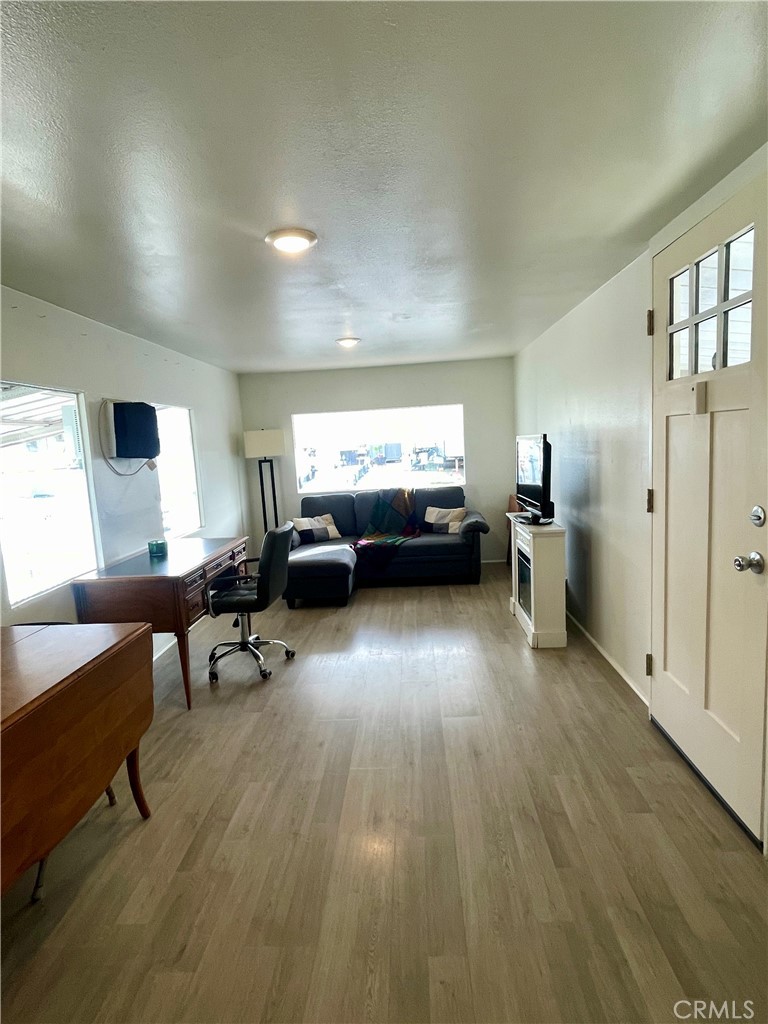 12995 6th Street Yucaipa, CA 92399 - Photo 3 of 13 a living room with furniture and a wooden floor