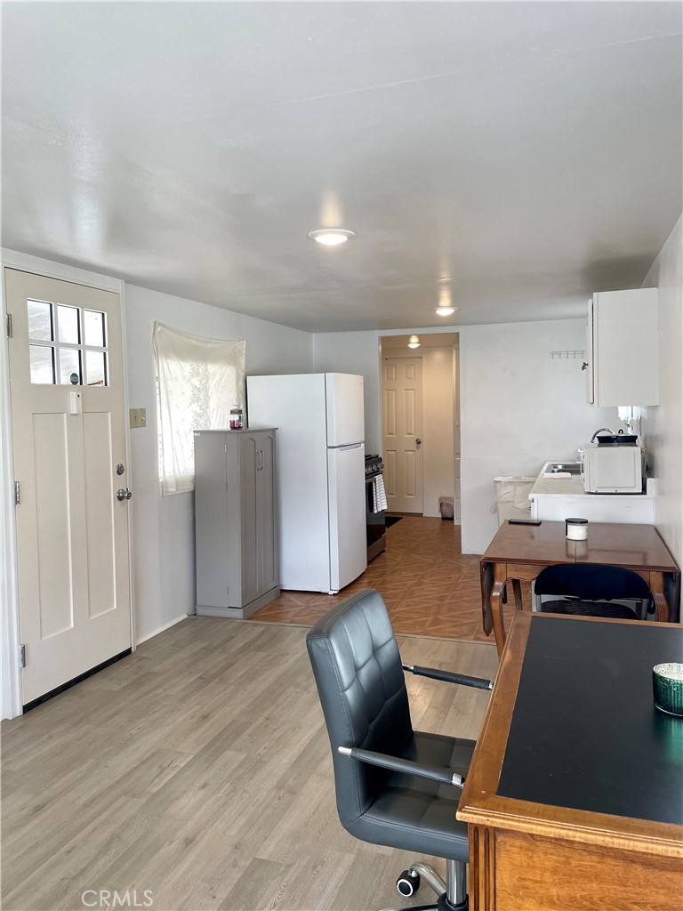 12995 6th Street Yucaipa, CA 92399 - Photo 5 of 13 a open kitchen with stainless steel appliances granite countertop a refrigerator and a stove top oven