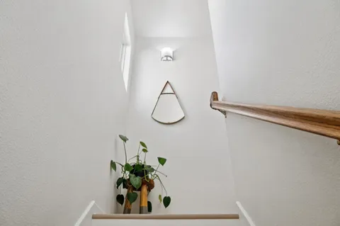 a bathroom with a shower and a mirror