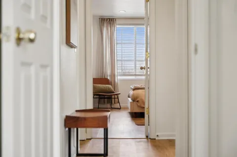 a reading room with furniture and a window