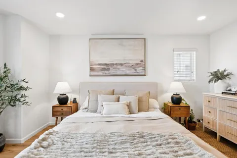 a bedroom with a bed and window