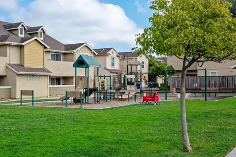 a front view of house with yard and outdoor seating