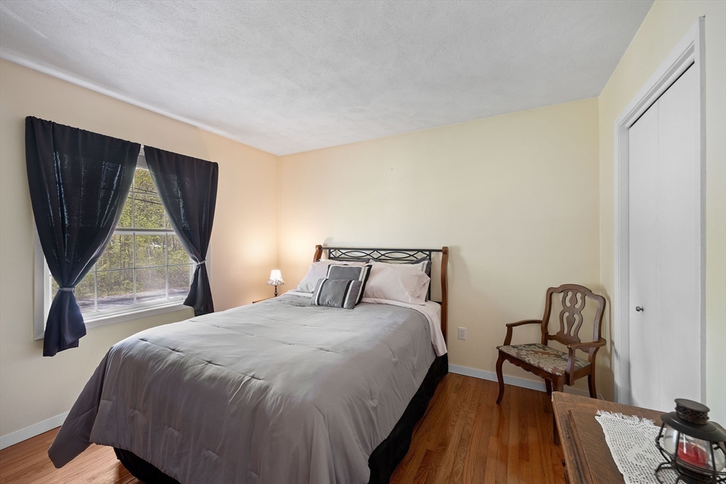 85 Tower Street Hudson, MA 01749 - Photo 12 of 25 a bed sitting in a bedroom next to a window