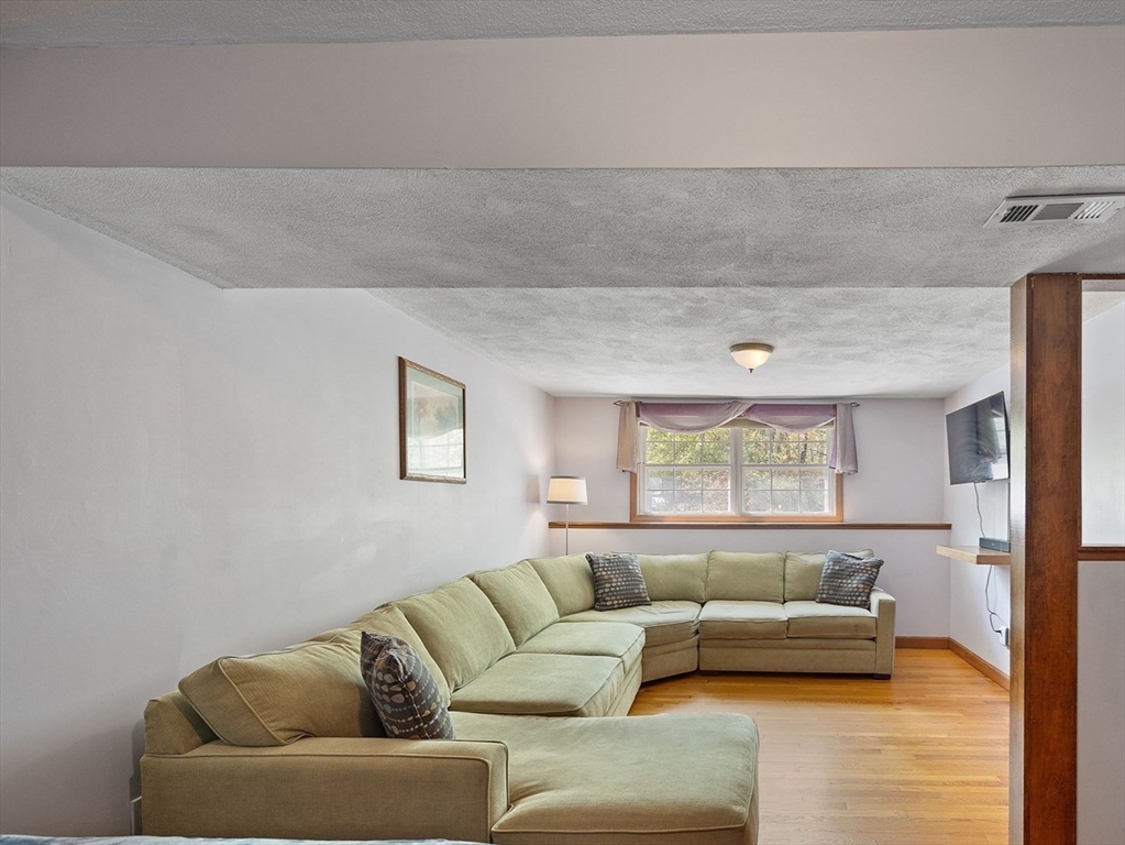 85 Tower Street Hudson, MA 01749 - Photo 17 of 25 a living room with furniture and a large window