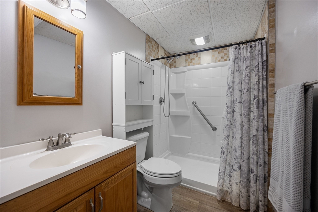 85 Tower Street Hudson, MA 01749 - Photo 18 of 25 a bathroom with a sink a toilet and shower