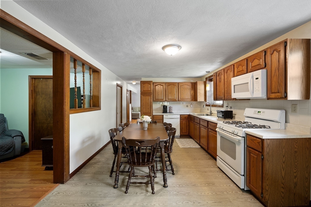 85 Tower Street Hudson, MA 01749 - Photo 19 of 25 a kitchen with a sink stove and cabinets