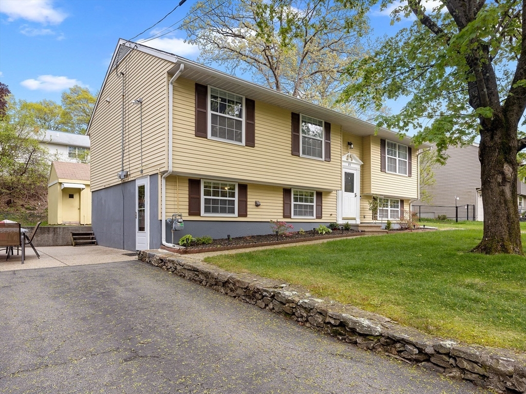 85 Tower Street Hudson, MA 01749 - Photo 2 of 25 a view of a house with a yard