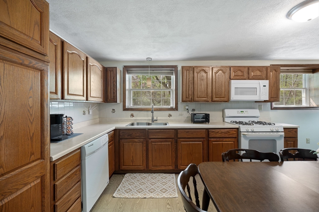85 Tower Street Hudson, MA 01749 - Photo 21 of 25 a kitchen with a sink cabinets and window