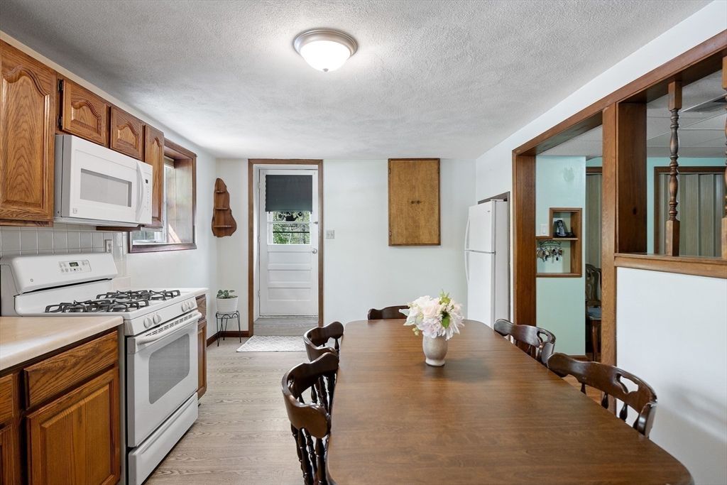 85 Tower Street Hudson, MA 01749 - Photo 22 of 25 a kitchen that has a lot of cabinets a sink and appliances in it